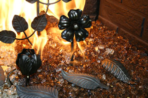 Metal decorative objects for the fireplace glass
